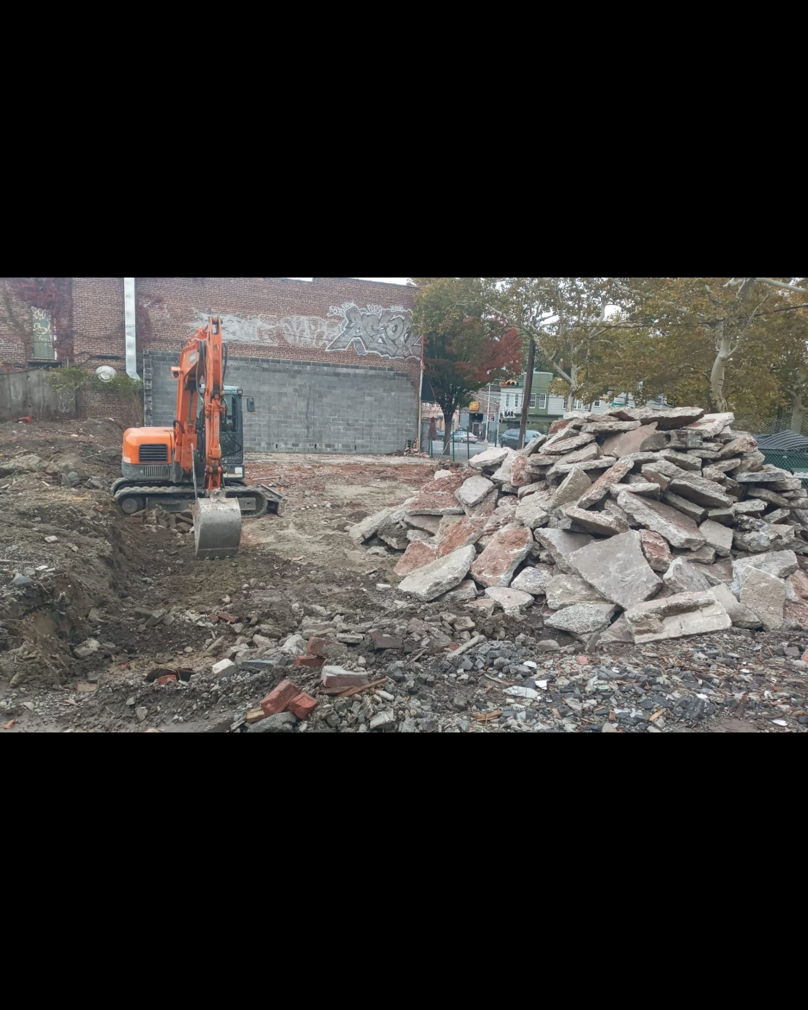 mini excavator on an active job site